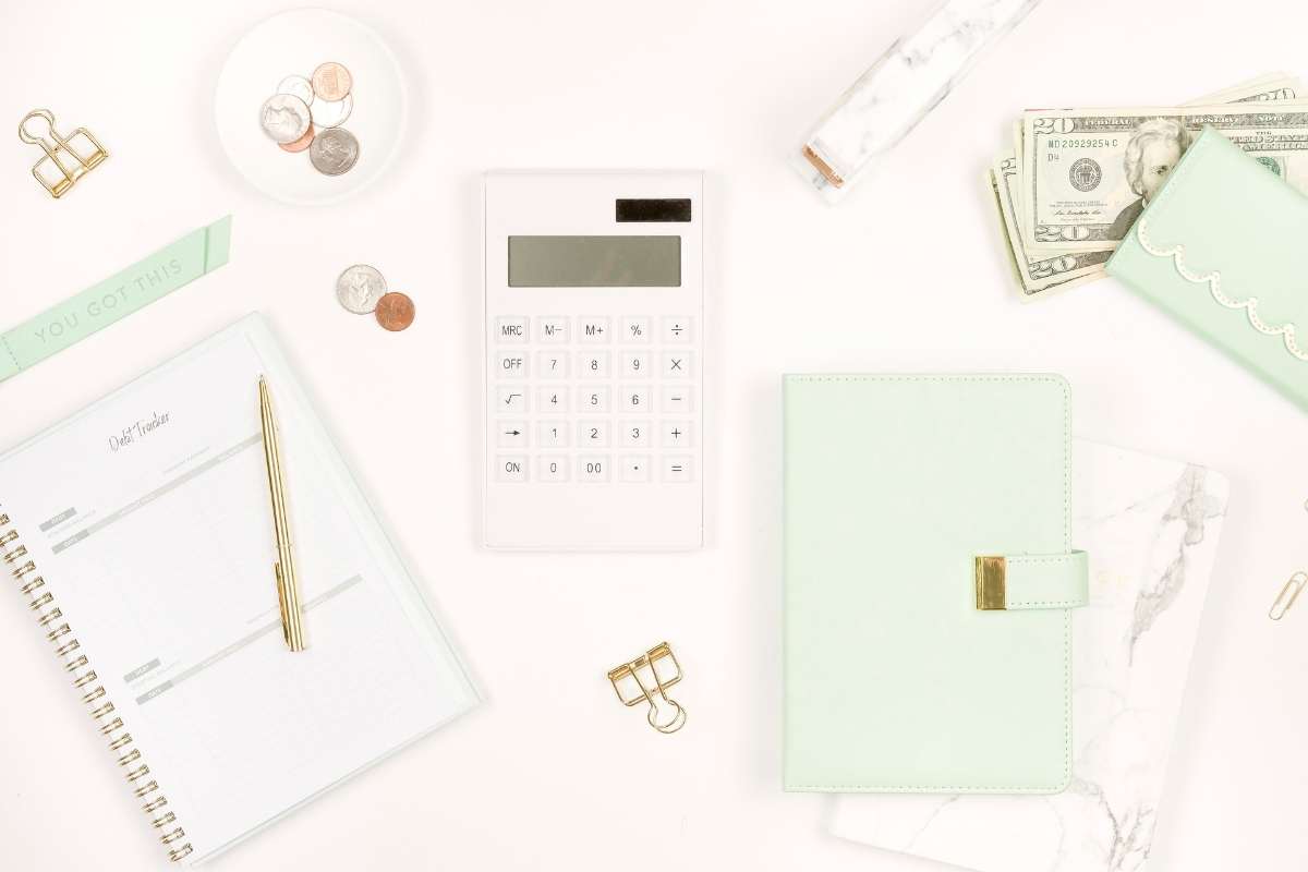 desktop scene with cash and calculator