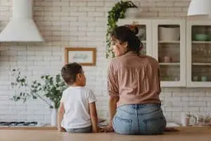 mom and kid sitting on counter