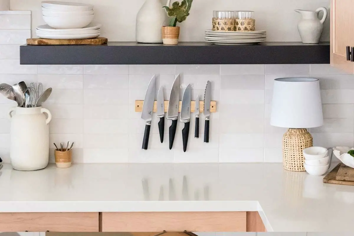kitchen wall with knives and no upper cabinets
